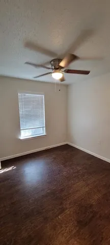 an empty room with a empty space and a window