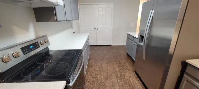 a view of a storage and utility room with washer and dryer