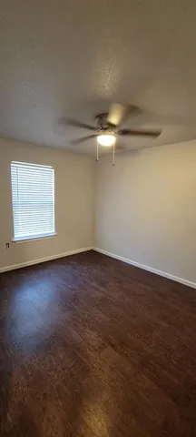 an empty room with a empty space and window