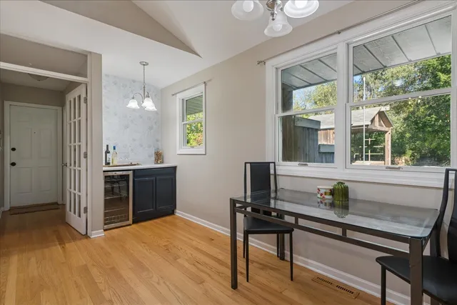 a living room with a window furniture and a kitchen view