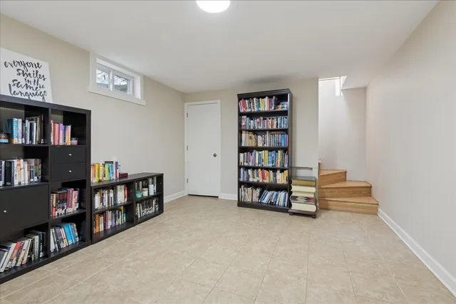 a room with furniture and a book shelf