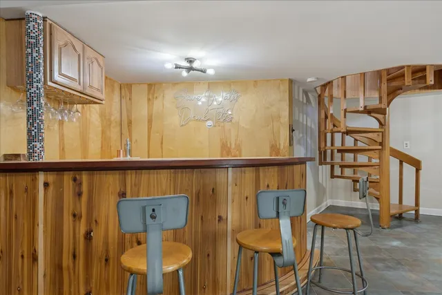 a view of a dining room with furniture and chandelier