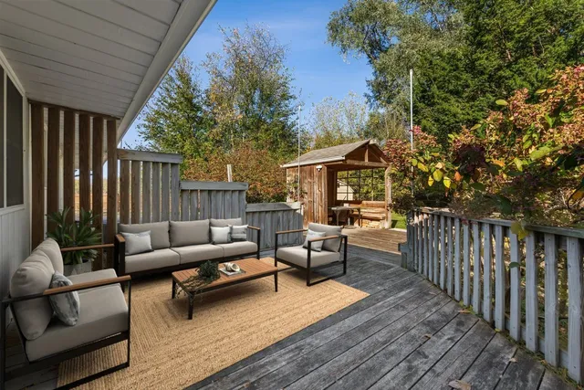 a patio with patio a couch and wooden floor