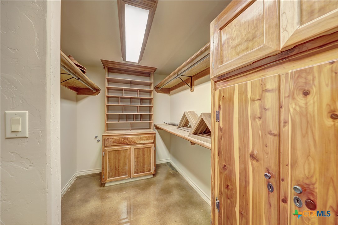 210 Center Point Drive Center Point, TX 78010 - Photo 20 of 44 Primary bedroom walk in cedar closet