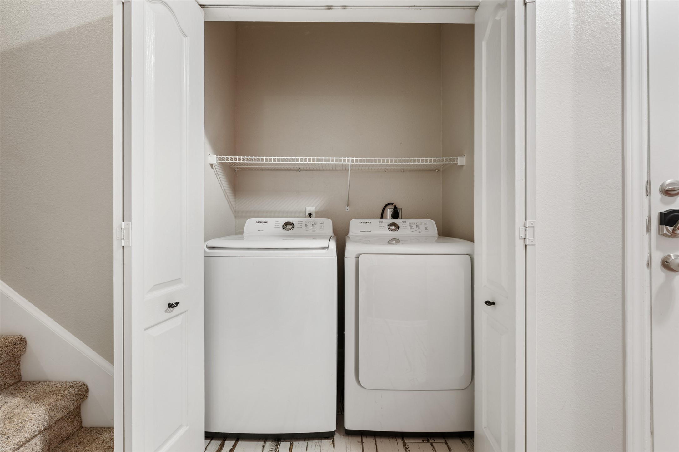11203 Ranch Road 2222, Unit 1407 Austin, TX 78732 - Photo 17 of 40 Convenient entry level laundry closet adjacent to the primary suite.