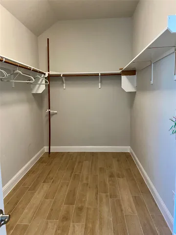 a view of a room with racks on the wall