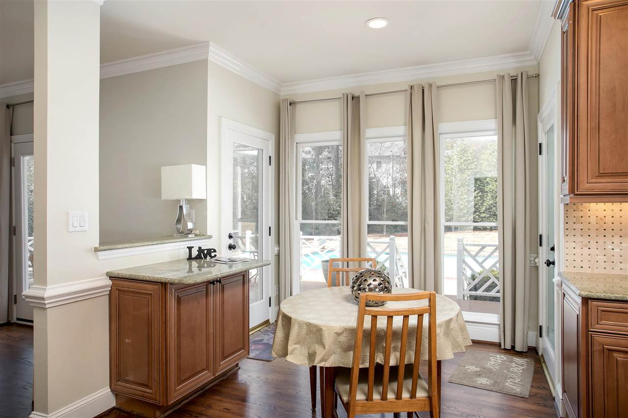 7102 Spring Ridge Road Cary, NC 27518 - Photo 11 of 25 SIT AND HAVE A BITE WHILE YOU LOOK OUT INTO YOUR PRIVATE POOL AND LUSH BACK YARD! BREAKFAST AREA