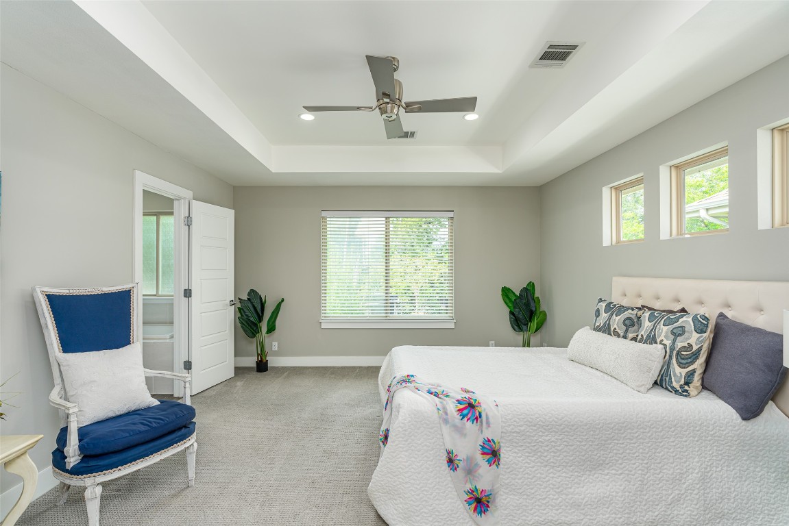 705 East 49th Street, Unit A Austin, TX 78751 - Photo 17 of 39 a bedroom with a bed and a couch