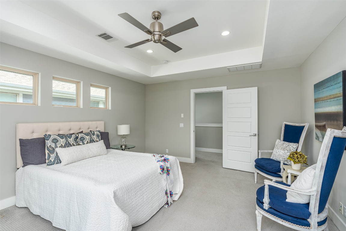 705 East 49th Street, Unit A Austin, TX 78751 - Photo 18 of 39 a bedroom with a bed window and chair