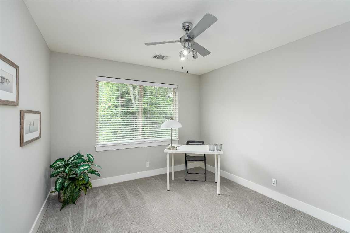 705 East 49th Street, Unit A Austin, TX 78751 - Photo 24 of 39 a view of workspace with a window and a ceiling fan