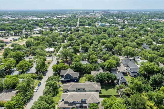 an aerial view of a city with lots of residential buildings