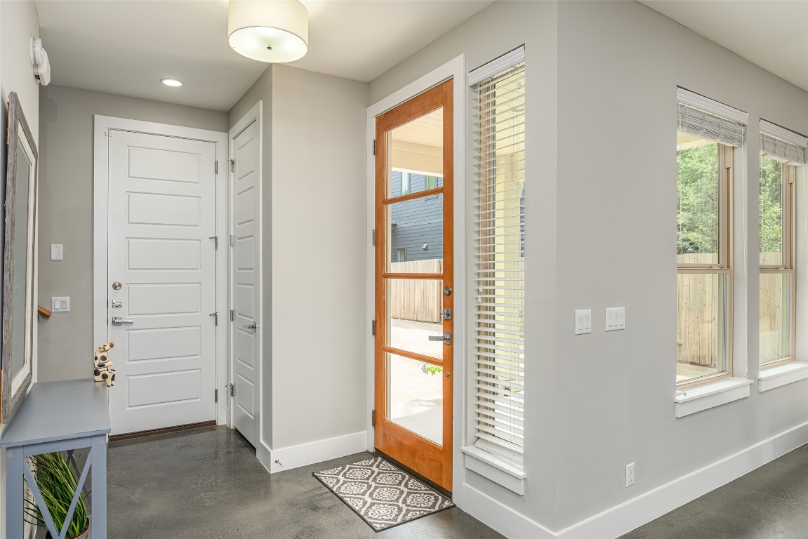 705 East 49th Street, Unit A Austin, TX 78751 - Photo 5 of 39 a view of an entryway with wooden floor and windows