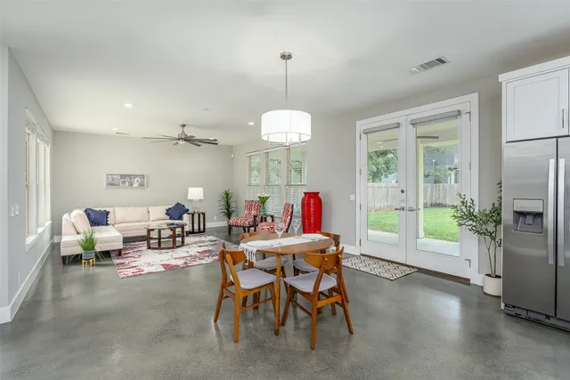 a view of a dining room with furniture window and outside view