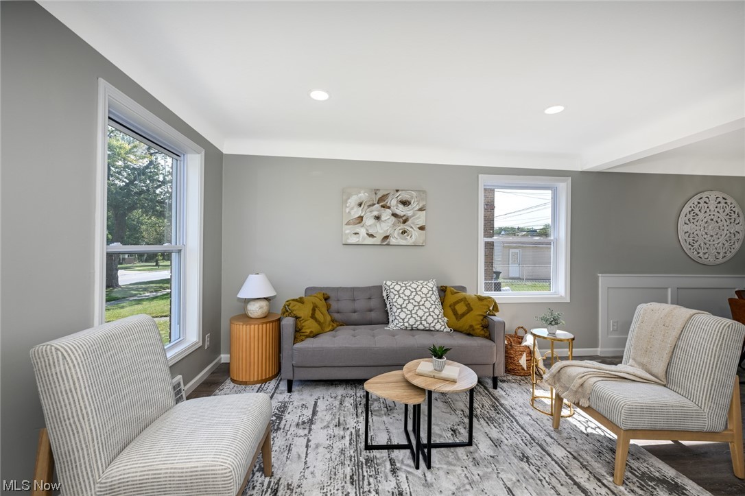 4446 Roadoan Road Brooklyn, OH 44144 - Photo 10 of 28 Vinyl flooring in living room with a healthy amount of sunlight