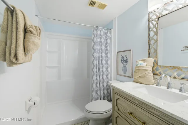 a bed room with a bed and a chandelier