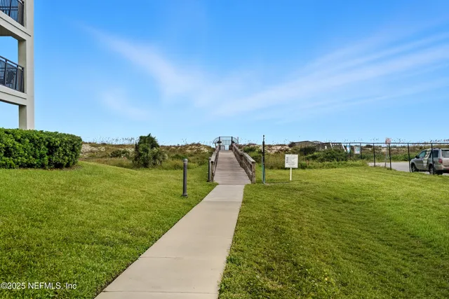 a view of house with yard