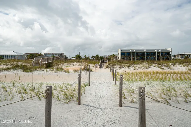 an aerial view of a house with a garden and outdoor space