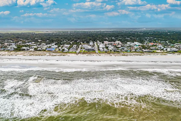 a kitchen with stainless steel appliances a refrigerator sink and cabinets