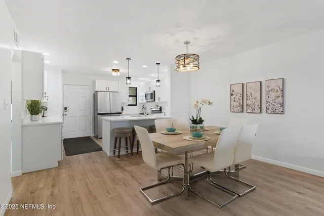 a kitchen with stainless steel appliances a stove sink and refrigerator