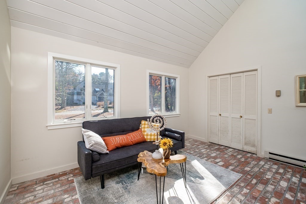 61 Tide Run Mashpee, MA 02649 - Photo 13 of 39 a living room with furniture and a large window