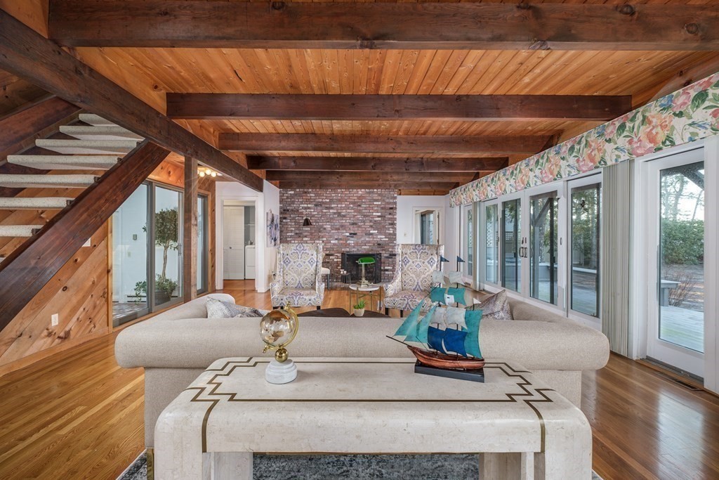 61 Tide Run Mashpee, MA 02649 - Photo 14 of 39 a living room with furniture and a fireplace