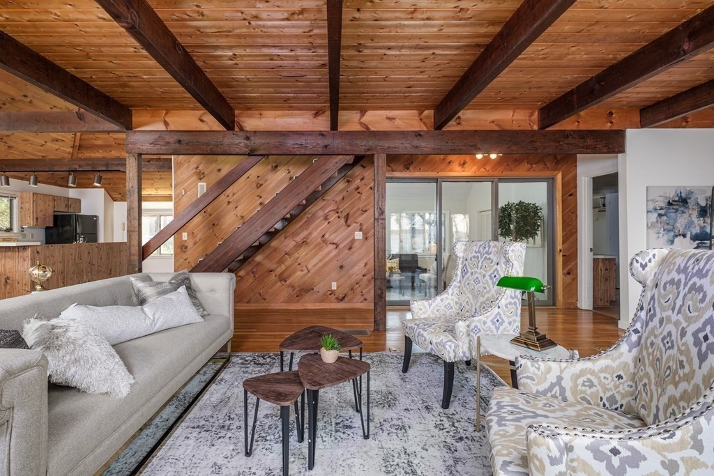 61 Tide Run Mashpee, MA 02649 - Photo 17 of 39 a living room with furniture and a chandelier