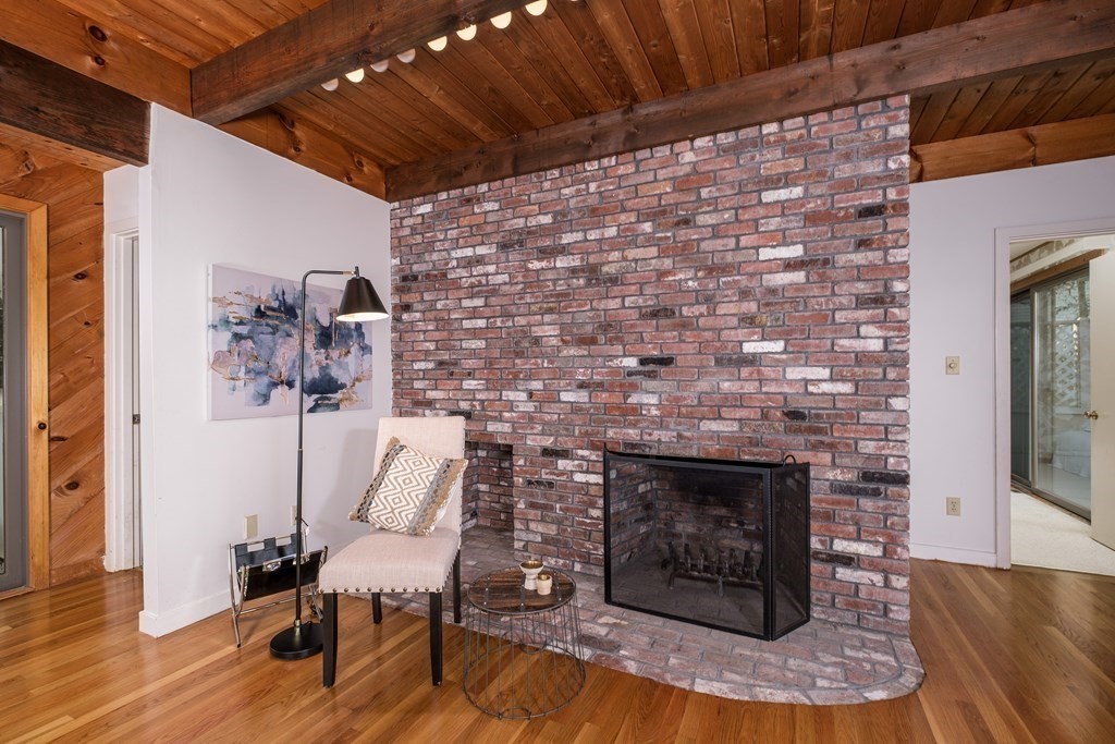 61 Tide Run Mashpee, MA 02649 - Photo 18 of 39 a living room with furniture and a fireplace