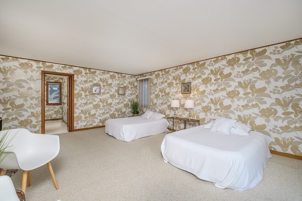 61 Tide Run Mashpee, MA 02649 - Photo 19 of 39 a living room with couches and a table