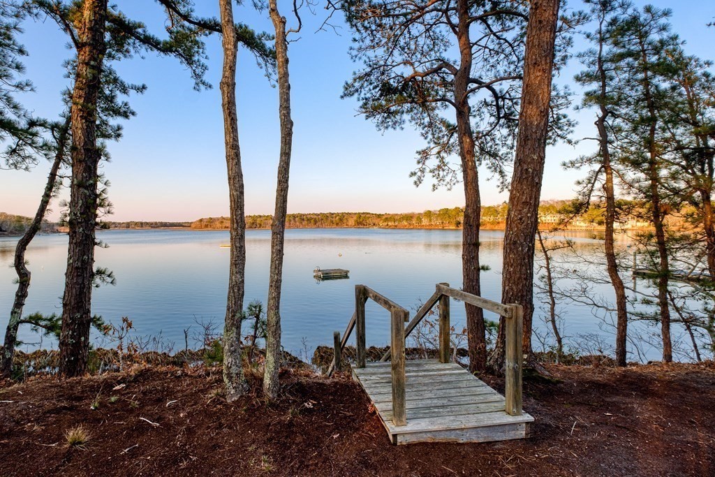 61 Tide Run Mashpee, MA 02649 - Photo 2 of 39 a view of a ocean with trees