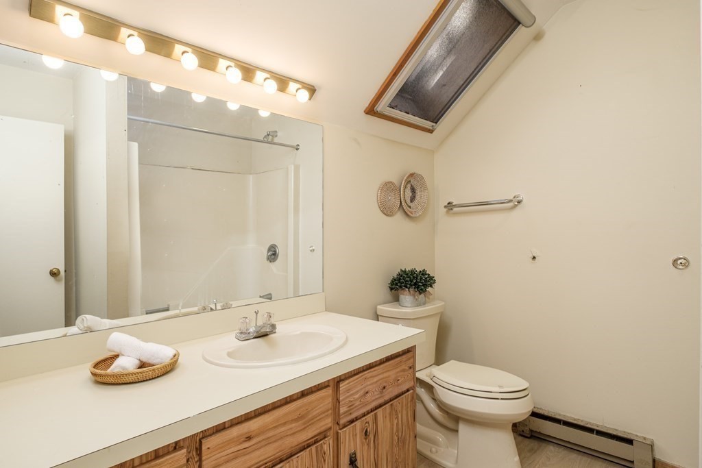 61 Tide Run Mashpee, MA 02649 - Photo 23 of 39 a bathroom with a sink and a mirror