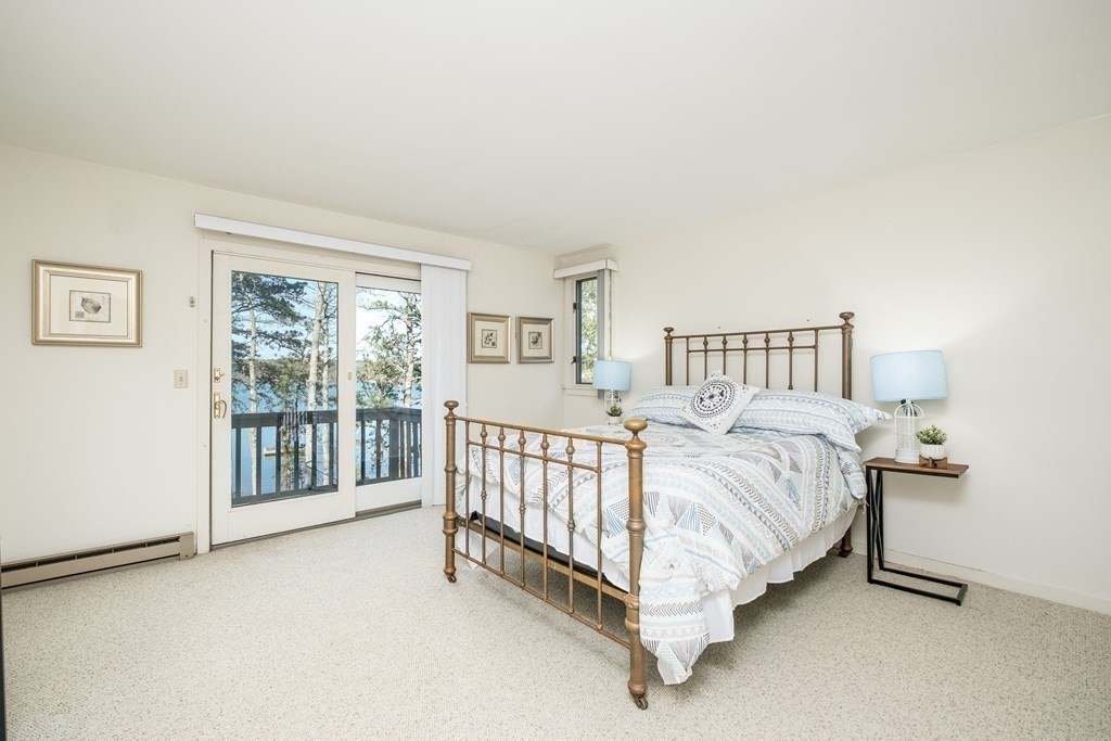 61 Tide Run Mashpee, MA 02649 - Photo 25 of 39 a bed sitting in a bedroom next to a window