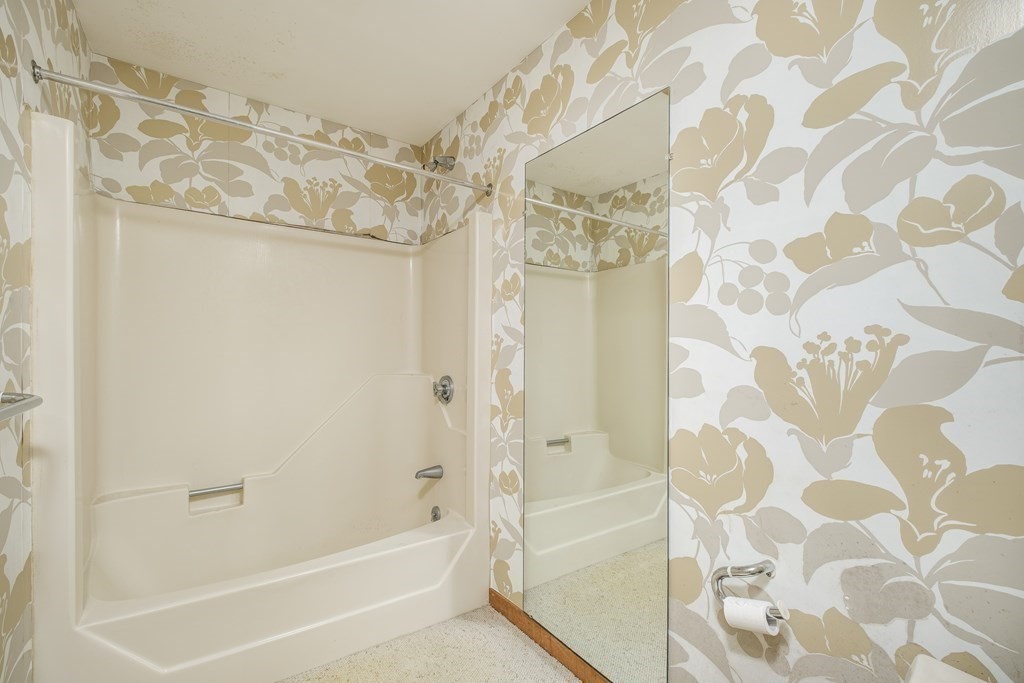 61 Tide Run Mashpee, MA 02649 - Photo 30 of 39 a bathroom with a bathtub and shower