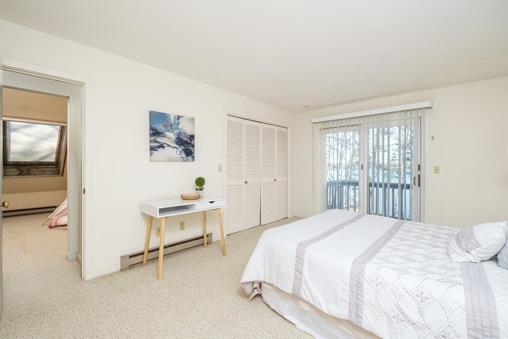 61 Tide Run Mashpee, MA 02649 - Photo 32 of 39 a spacious bedroom with a bed and a window