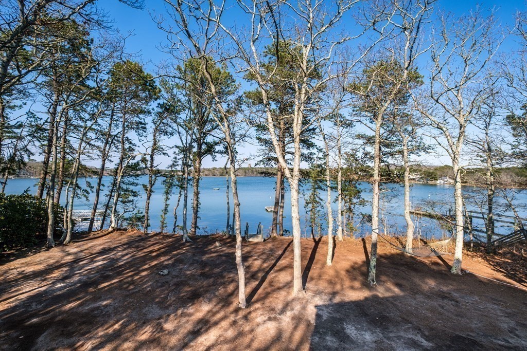 61 Tide Run Mashpee, MA 02649 - Photo 35 of 39 a view of a backyard with wooden fence