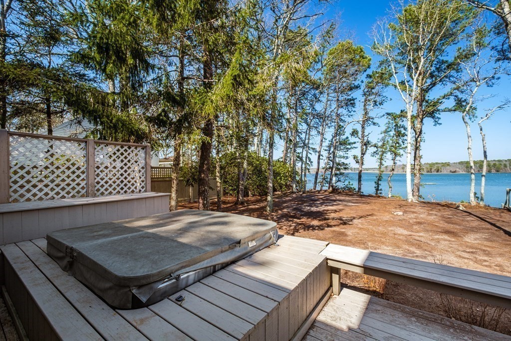 61 Tide Run Mashpee, MA 02649 - Photo 7 of 39 a view of a backyard with wooden floor