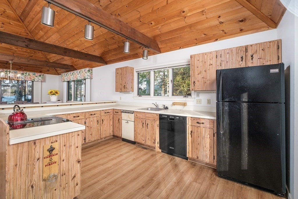 61 Tide Run Mashpee, MA 02649 - Photo 9 of 39 a kitchen with stainless steel appliances a refrigerator and a stove