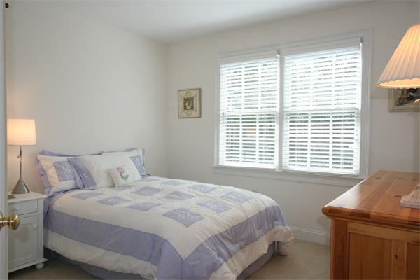 45 Deerpath Road Dedham, MA 02026 - Photo 11 of 12 a bedroom with a bed and a window