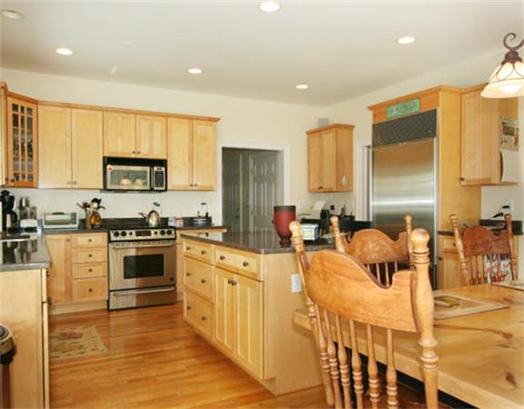 45 Deerpath Road Dedham, MA 02026 - Photo 4 of 12 a large kitchen with stainless steel appliances lots of counter space and a sink