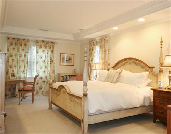 45 Deerpath Road Dedham, MA 02026 - Photo 8 of 12 a bedroom with a bed and lamp