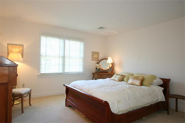 45 Deerpath Road Dedham, MA 02026 - Photo 10 of 12 a bedroom with a bed and window