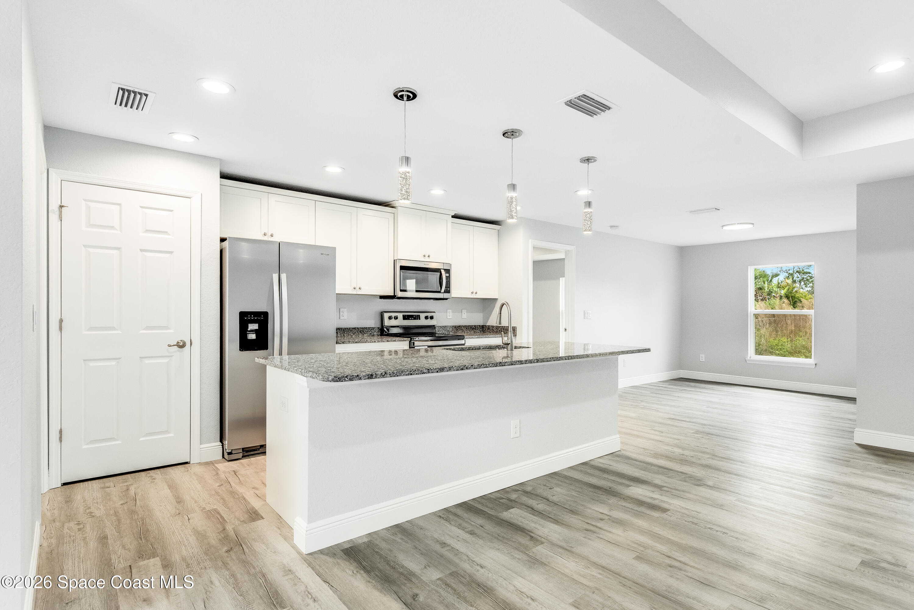 1434 Weiman Road Southeast Palm Bay, FL 32909 - Photo 9 of 38 9. Kitchen:Dining:Pantry Door