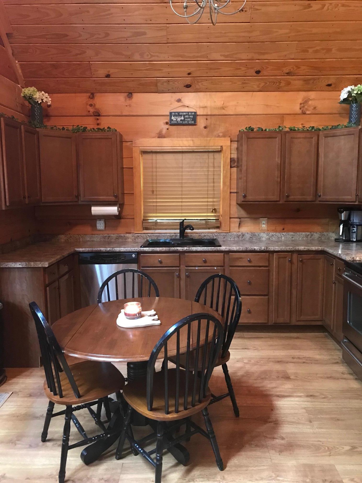 213 South Dickerson Chapel Road Lebanon, TN 37087 - Photo 19 of 30 a kitchen with a dining table chairs and a refrigerator