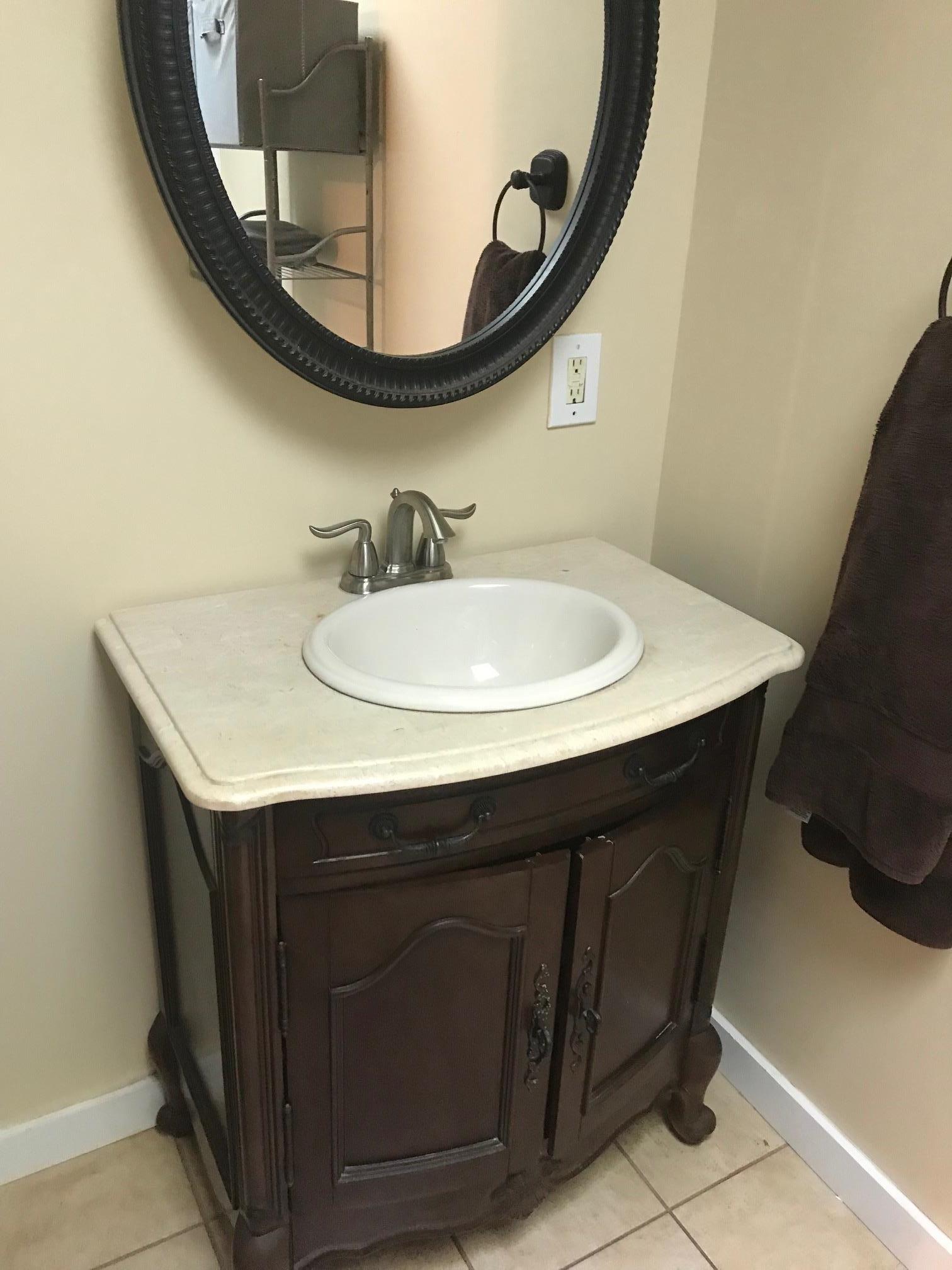 213 South Dickerson Chapel Road Lebanon, TN 37087 - Photo 27 of 30 a bathroom with a sink and a mirror