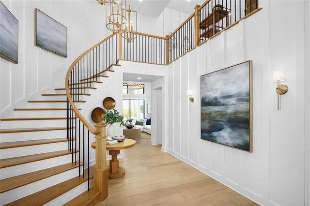a view of entryway dining room and hall with wooden floor