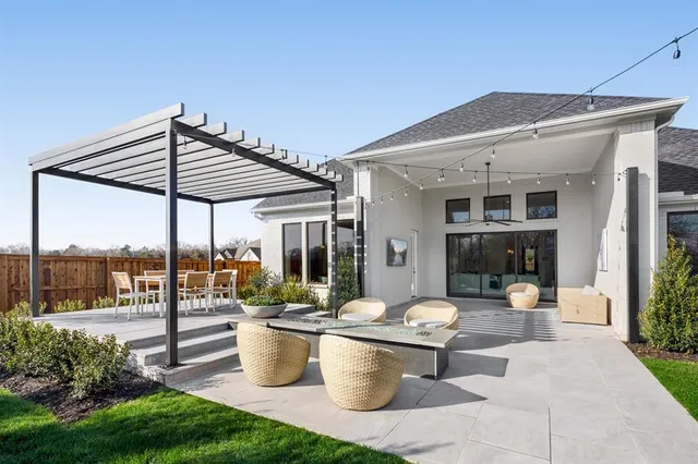 a patio view with a table and chairs