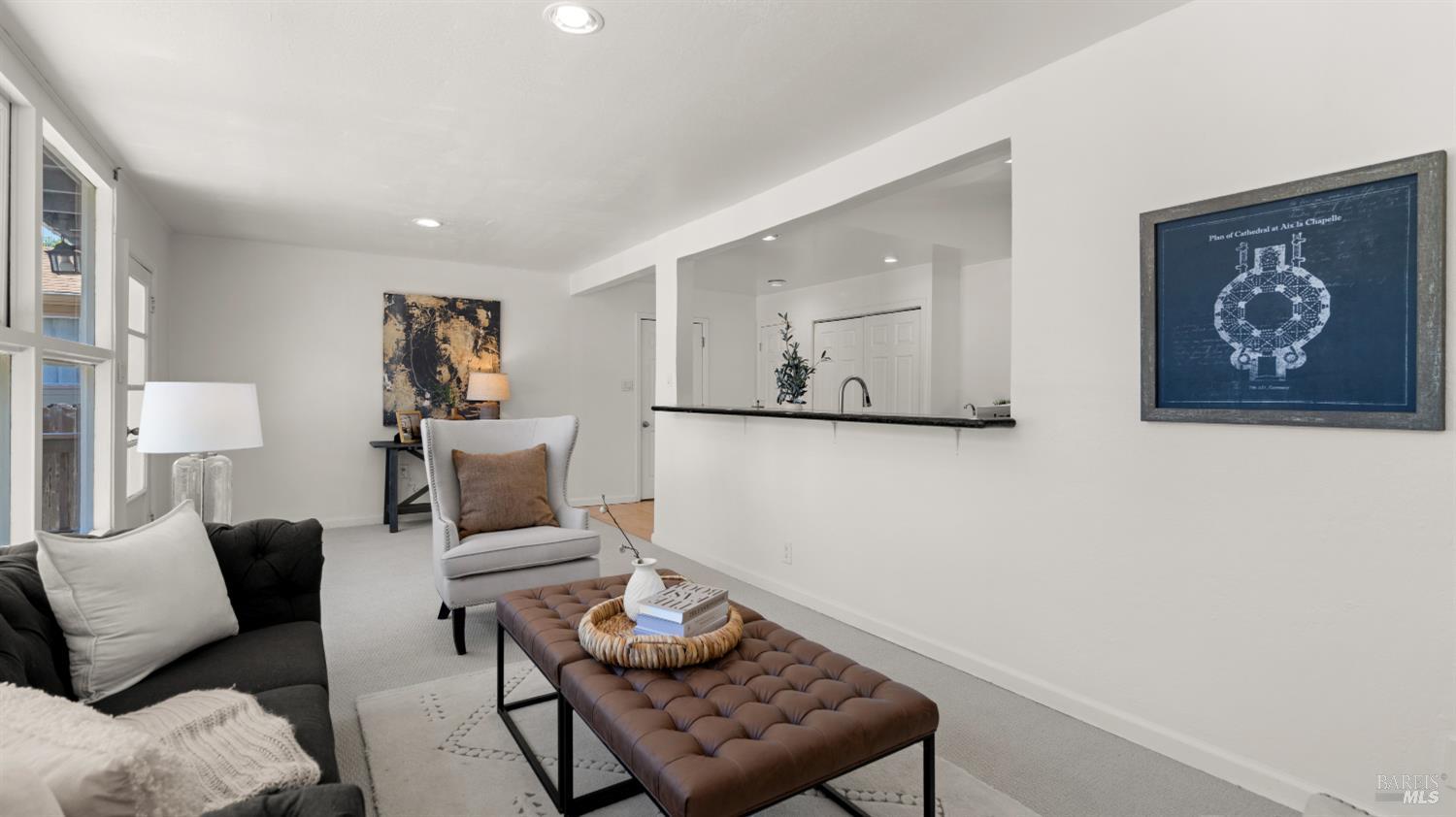 38 Bret Avenue San Rafael, CA 94901 - Photo 24 of 52 a living room with furniture and a wall painting