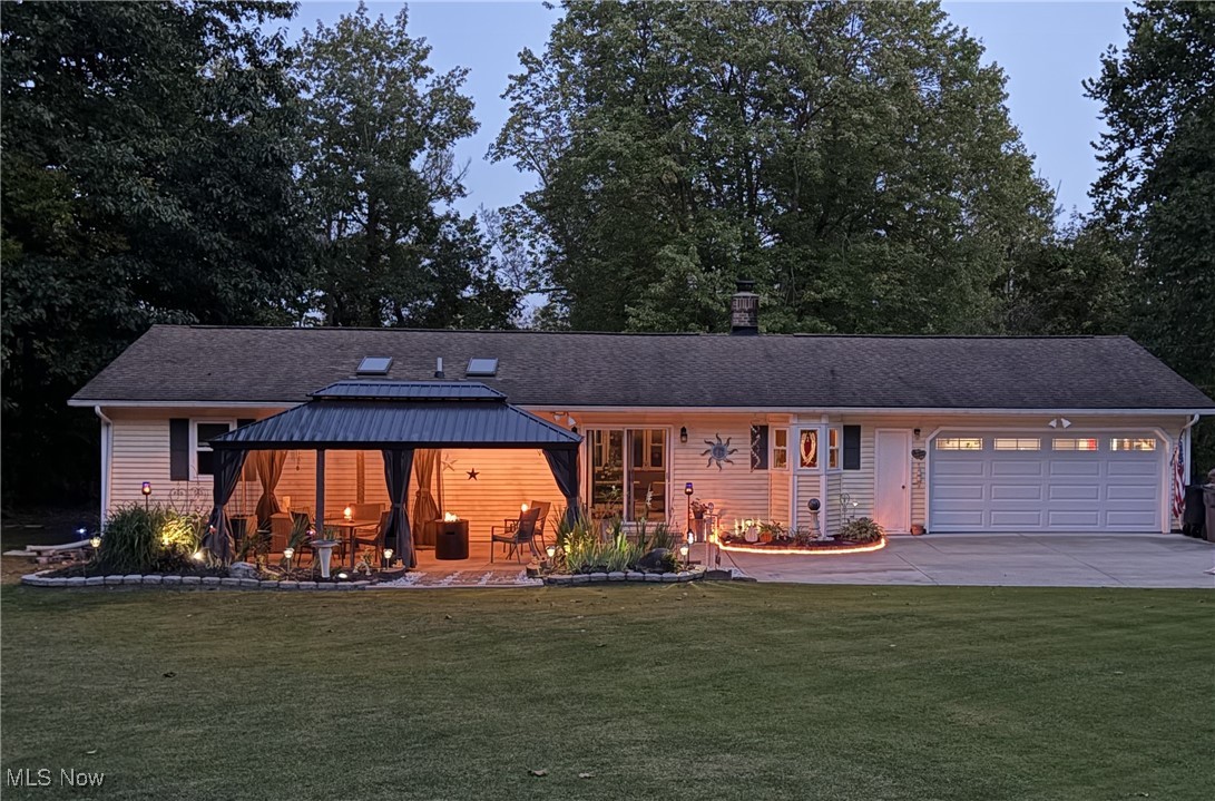11524 Lakeview Road Chardon, OH 44024 - Photo 13 of 50 Lighted Pergola and fire features on a paved patio