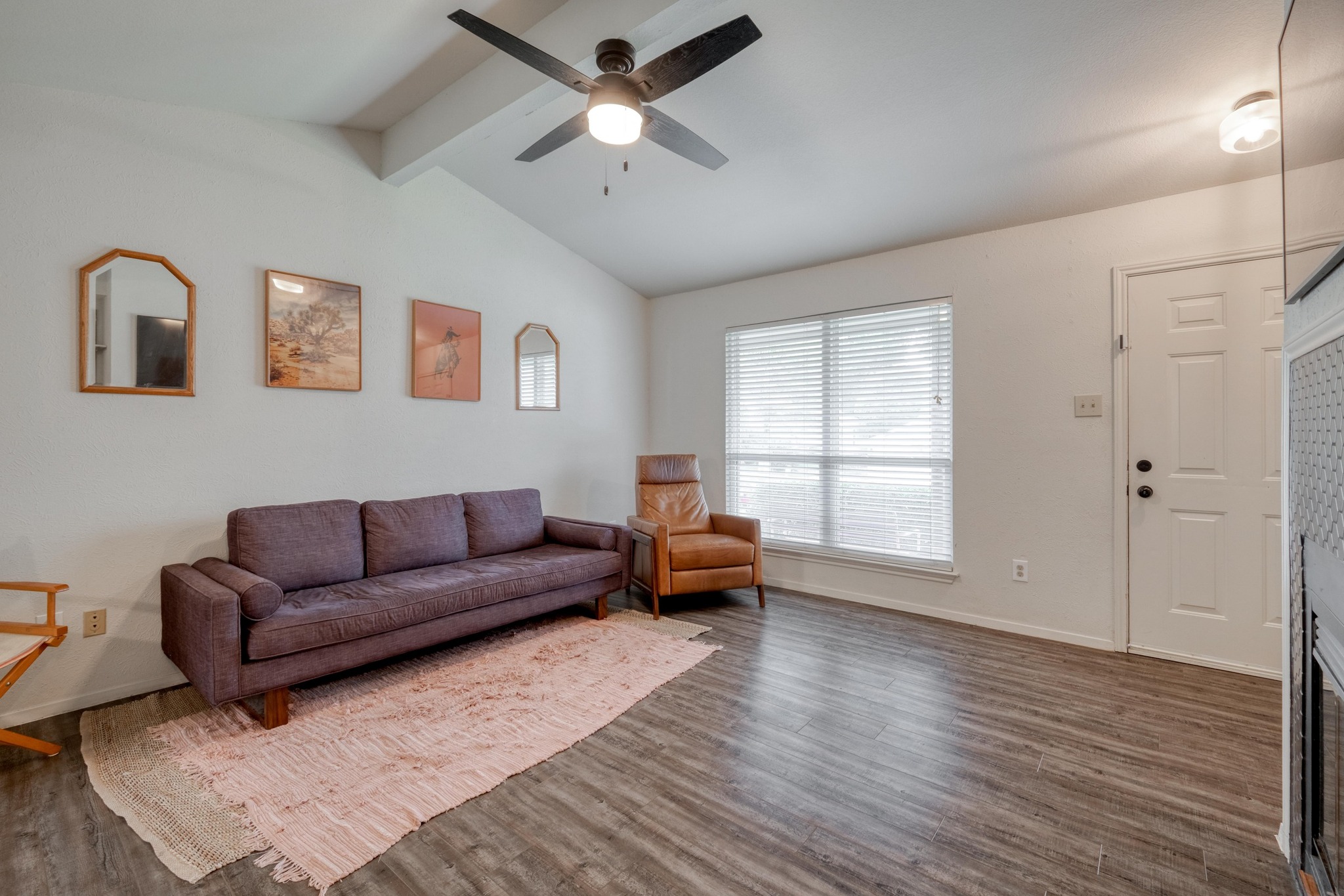 Natural light fills the living area, offering a versatile space for everyday living and entertaining.
