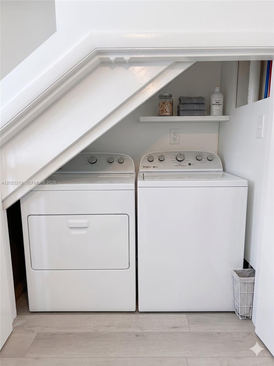 13 Southwest 3rd Street, Unit 13 Pompano Beach, FL 33060 - Photo 13 of 44 a utility room with dryer and washer