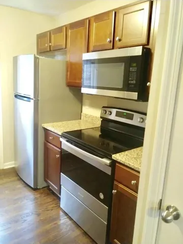 a kitchen with a stove and a microwave